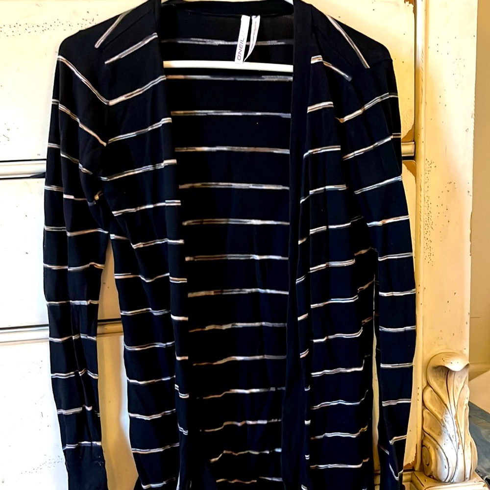 Oneill long cardigan black w/ beige and white strips . Has pockets